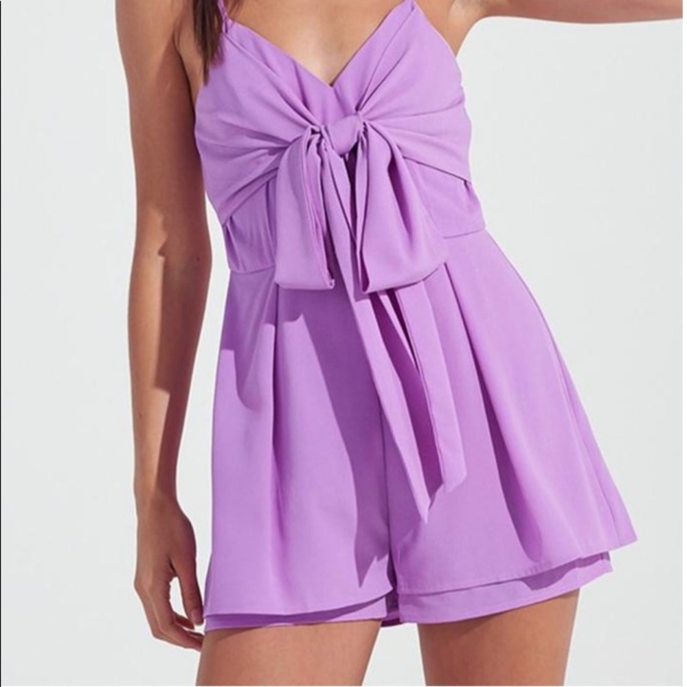 Purple romper with front tie. Only worn once!